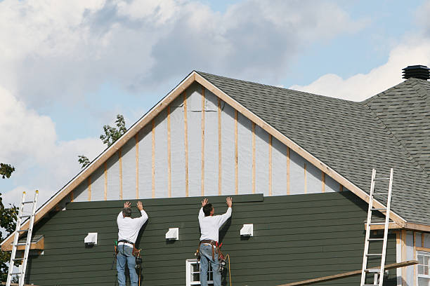 Professional Storm Damage Siding Repair technician working in Castle Rock, WA